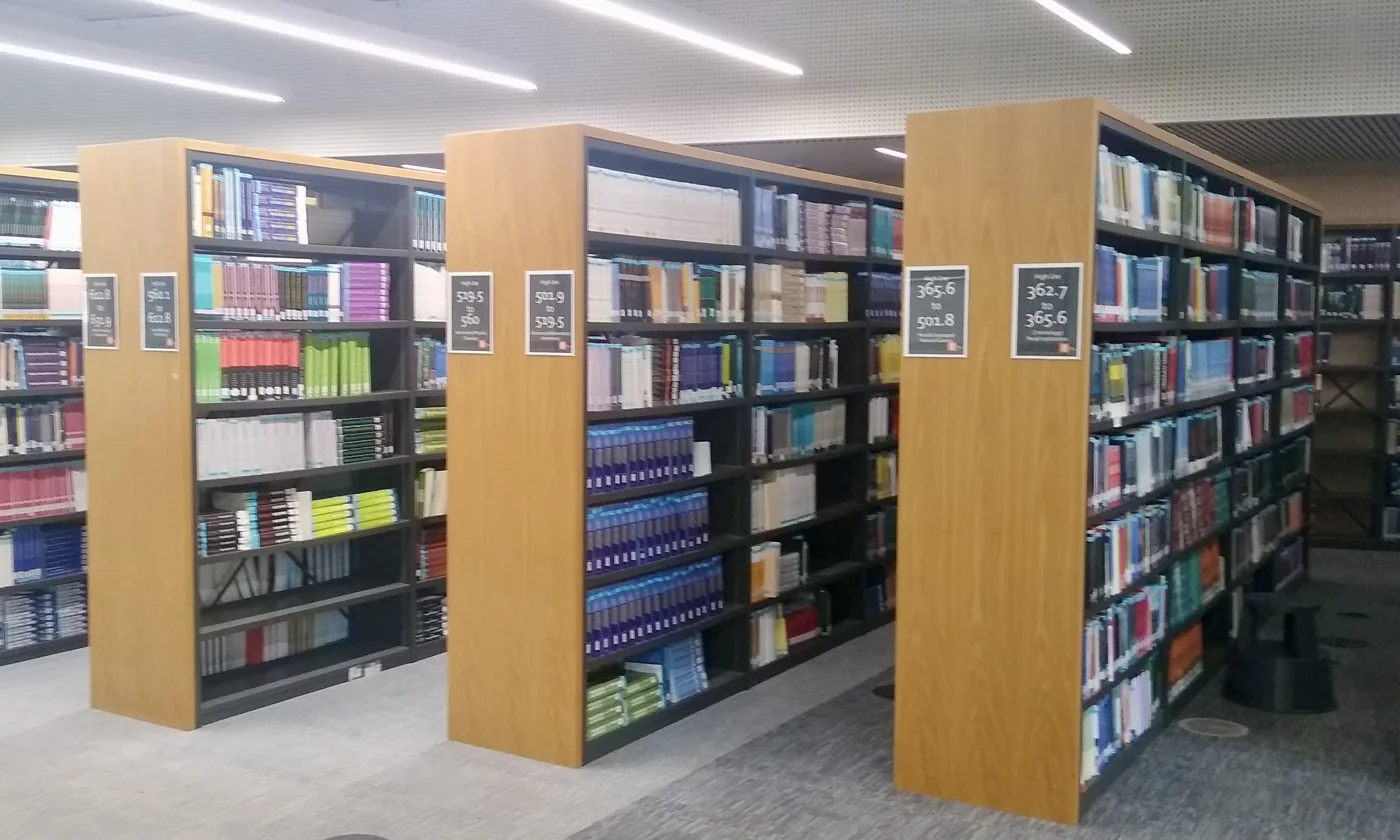 Books arranged on shelves in a university library